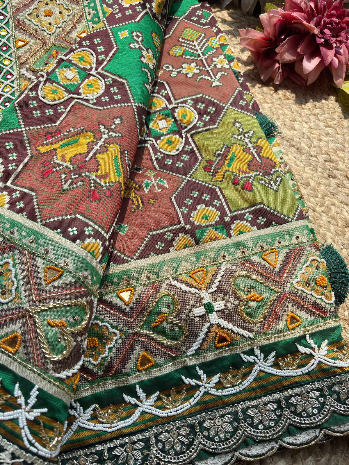 Green Patola Saree with Animal Motifs & Embellished Border