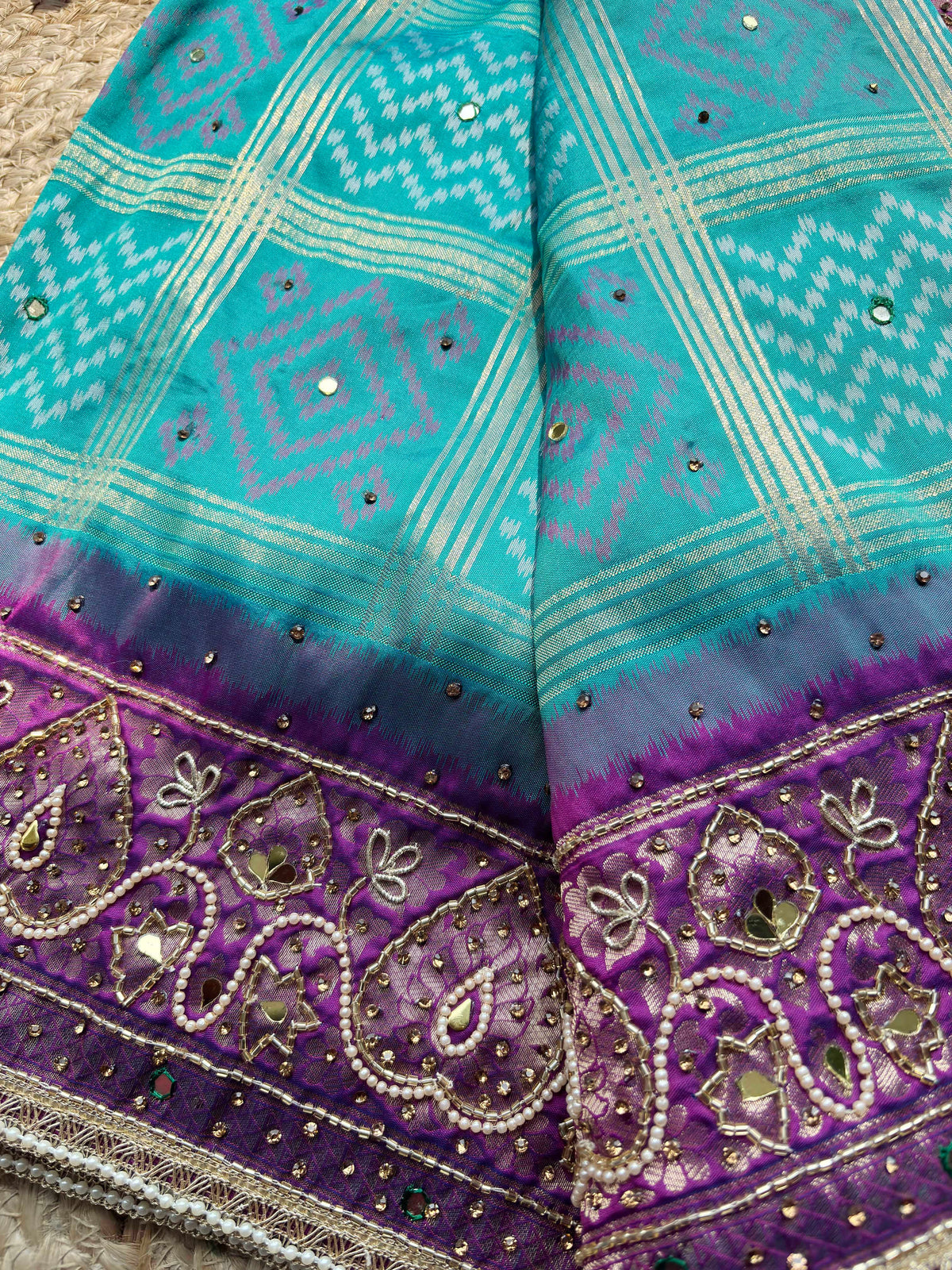 Turquoise Patola Saree with Purple Embellished Paisley Border