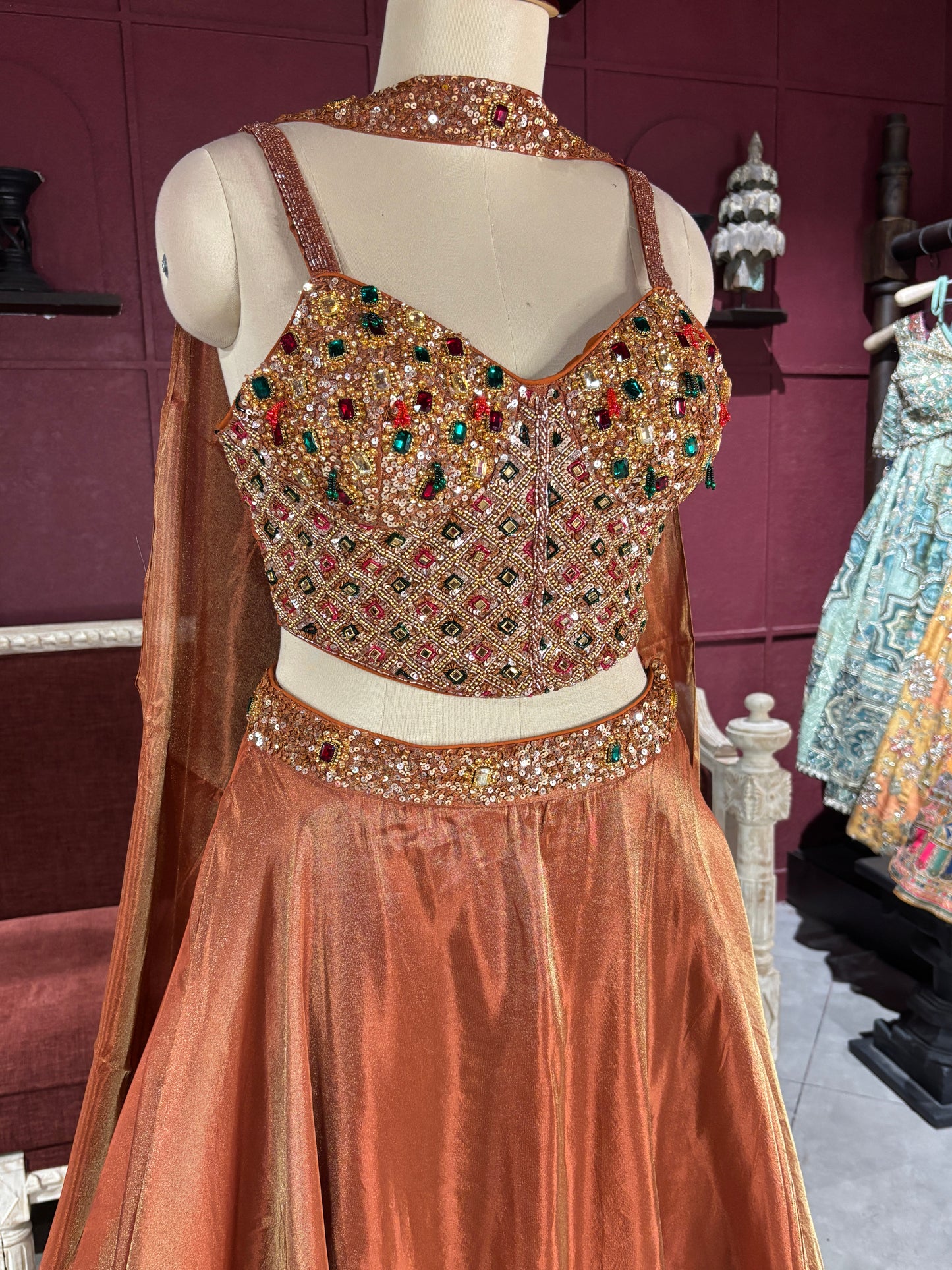 Designer Bronze Lehenga with Multicolor Embellished Blouse