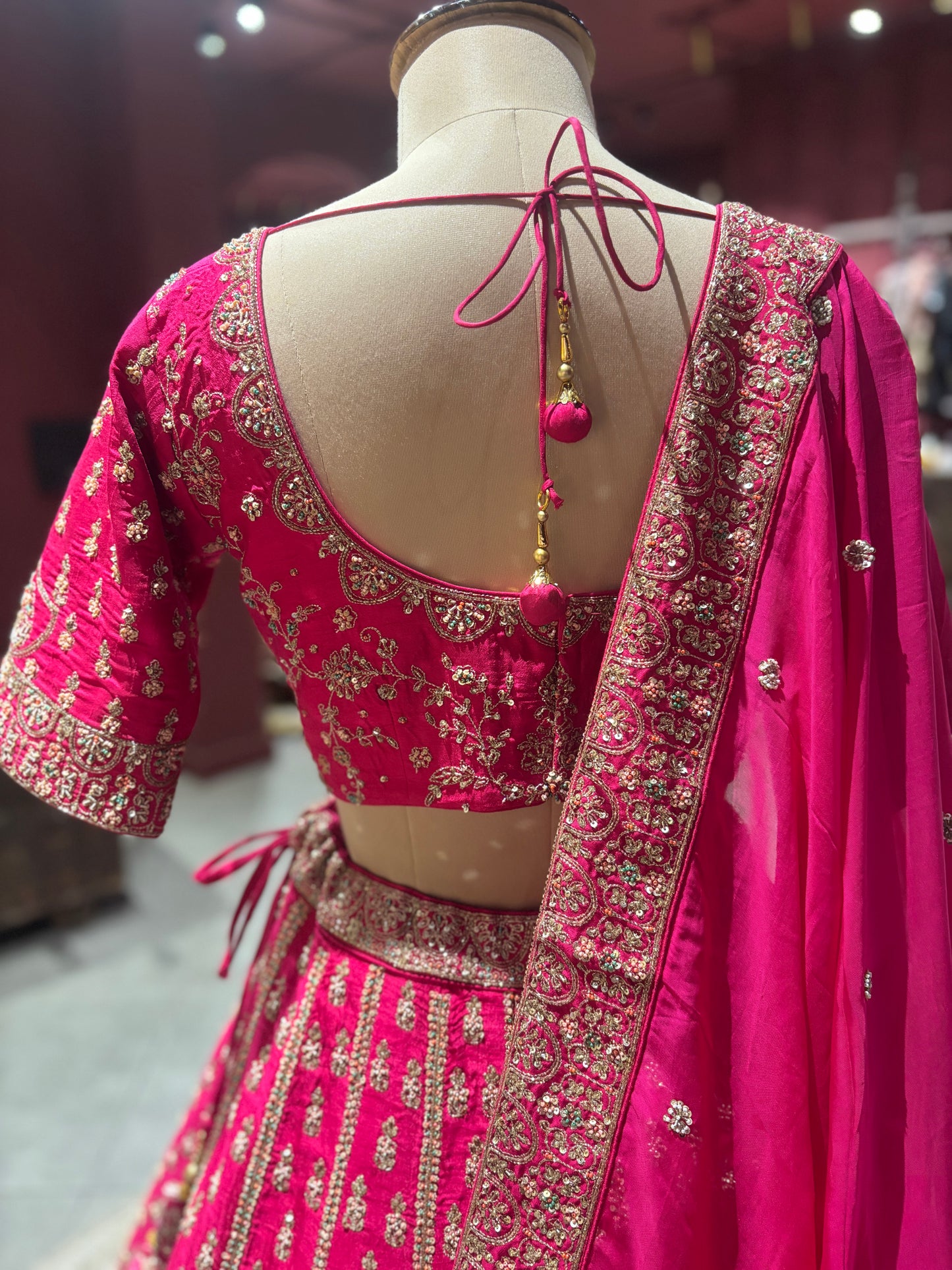 Rani Pink Zari Embroidered Bridal Lehenga with Net Dupatta