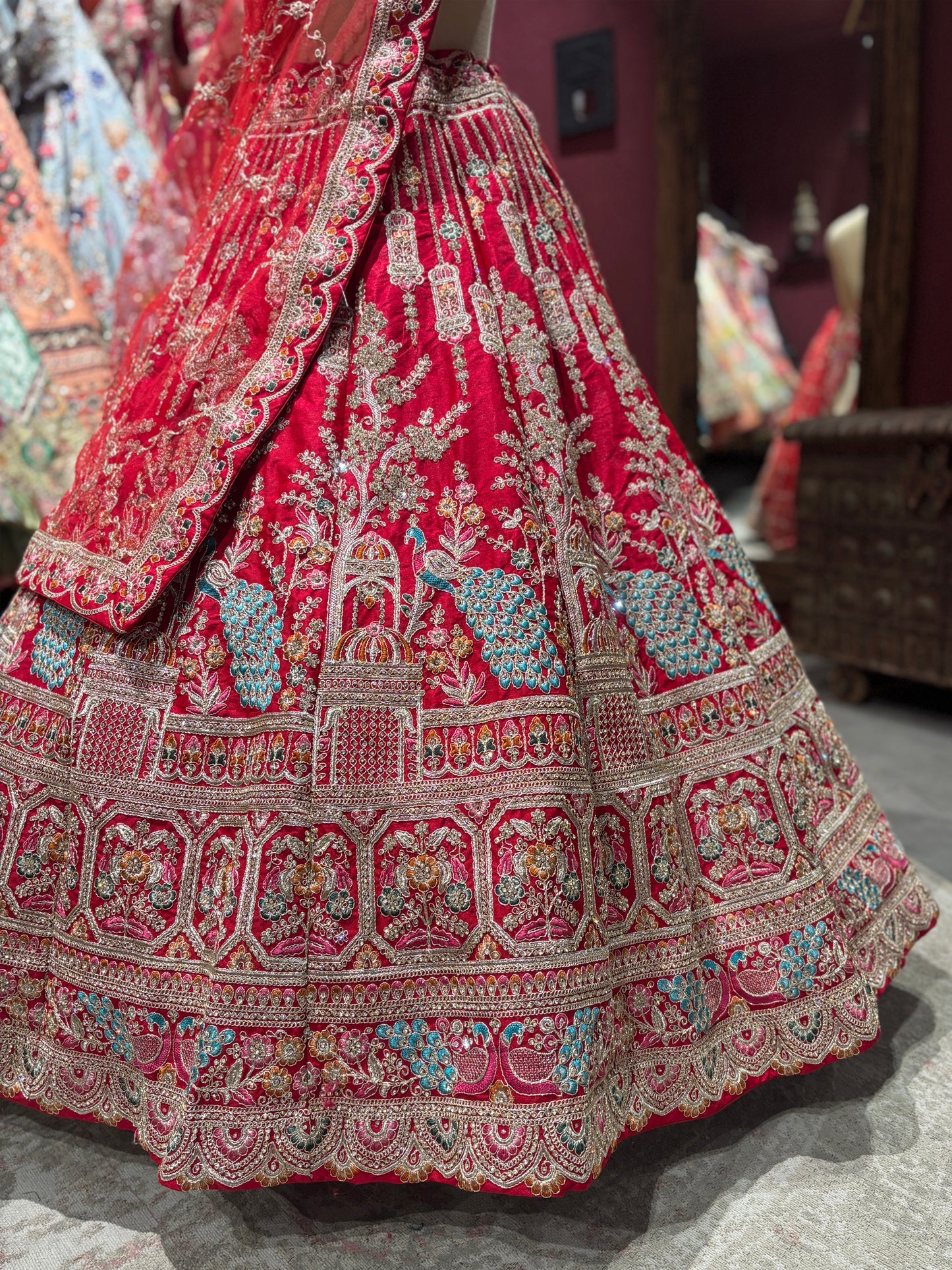 Designer Red Unstitched Bridal Lehenga with Peacock Zari Embroidery