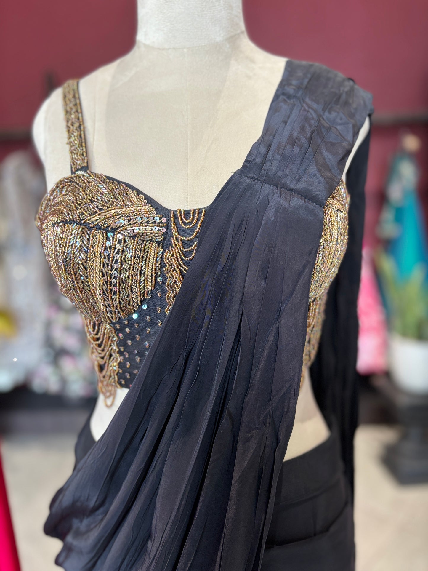 Black Designer Saree with Gold Embellished Blouse & Modern Draped Look