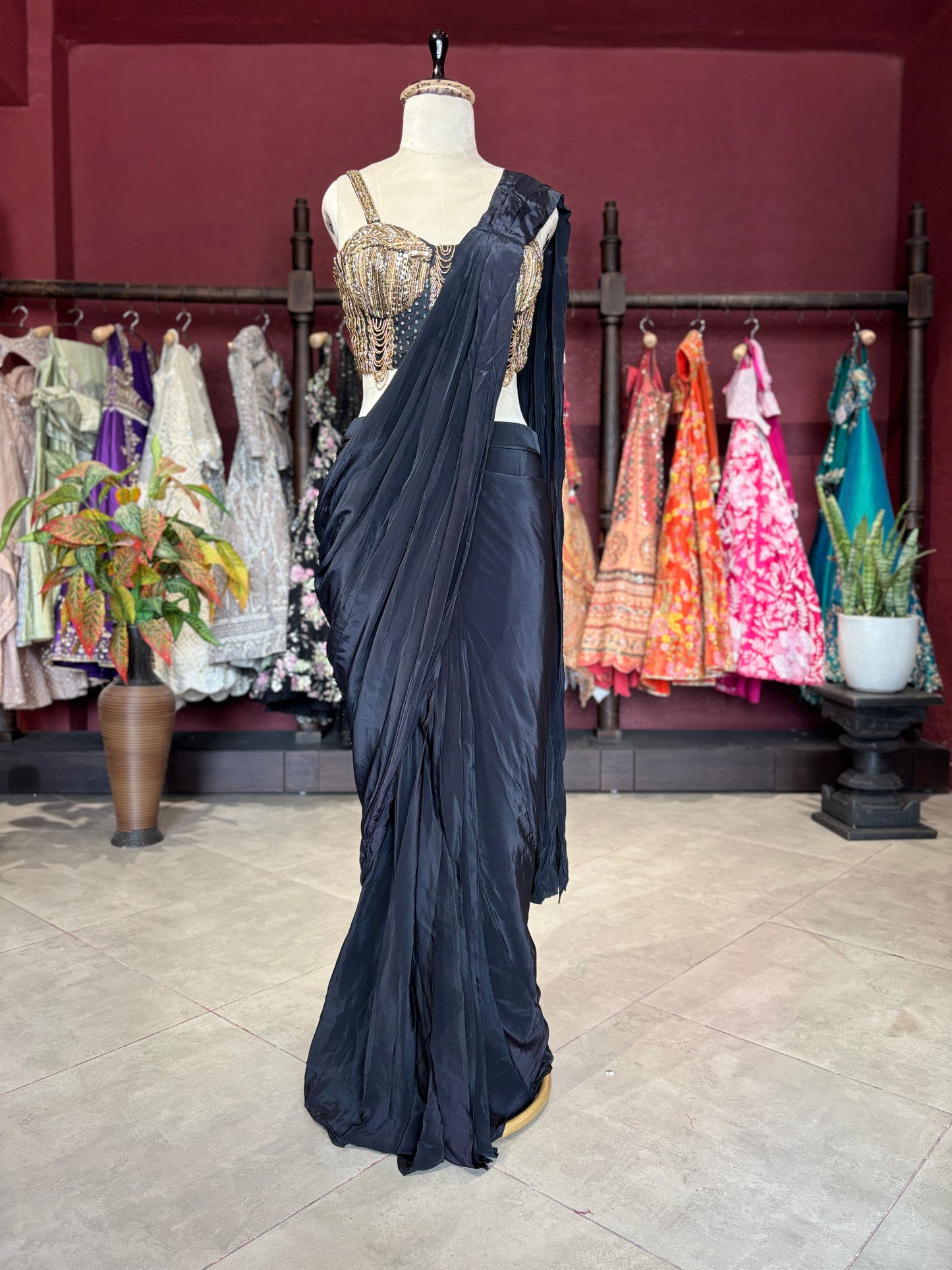 Black Designer Saree with Gold Embellished Blouse & Modern Draped Look