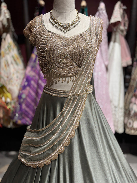 Metallic Grey Draped Lehenga Set with Gold Embellished Blouse