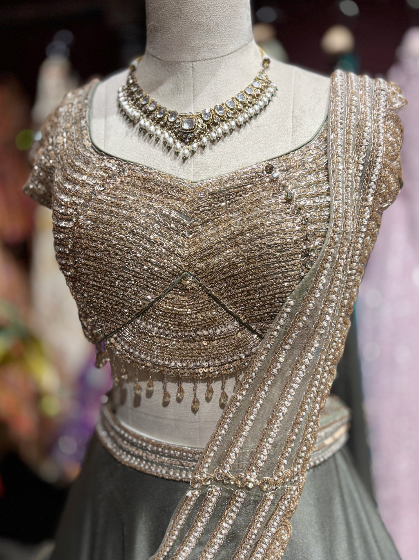 Metallic Grey Draped Lehenga Set with Gold Embellished Blouse