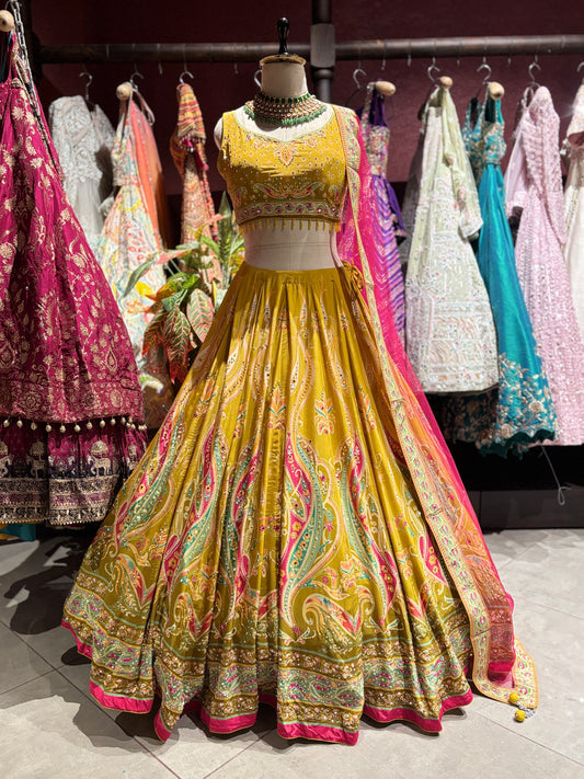 Mustard Yellow Paisley Embellished Lehenga Choli with Pink Dupatta