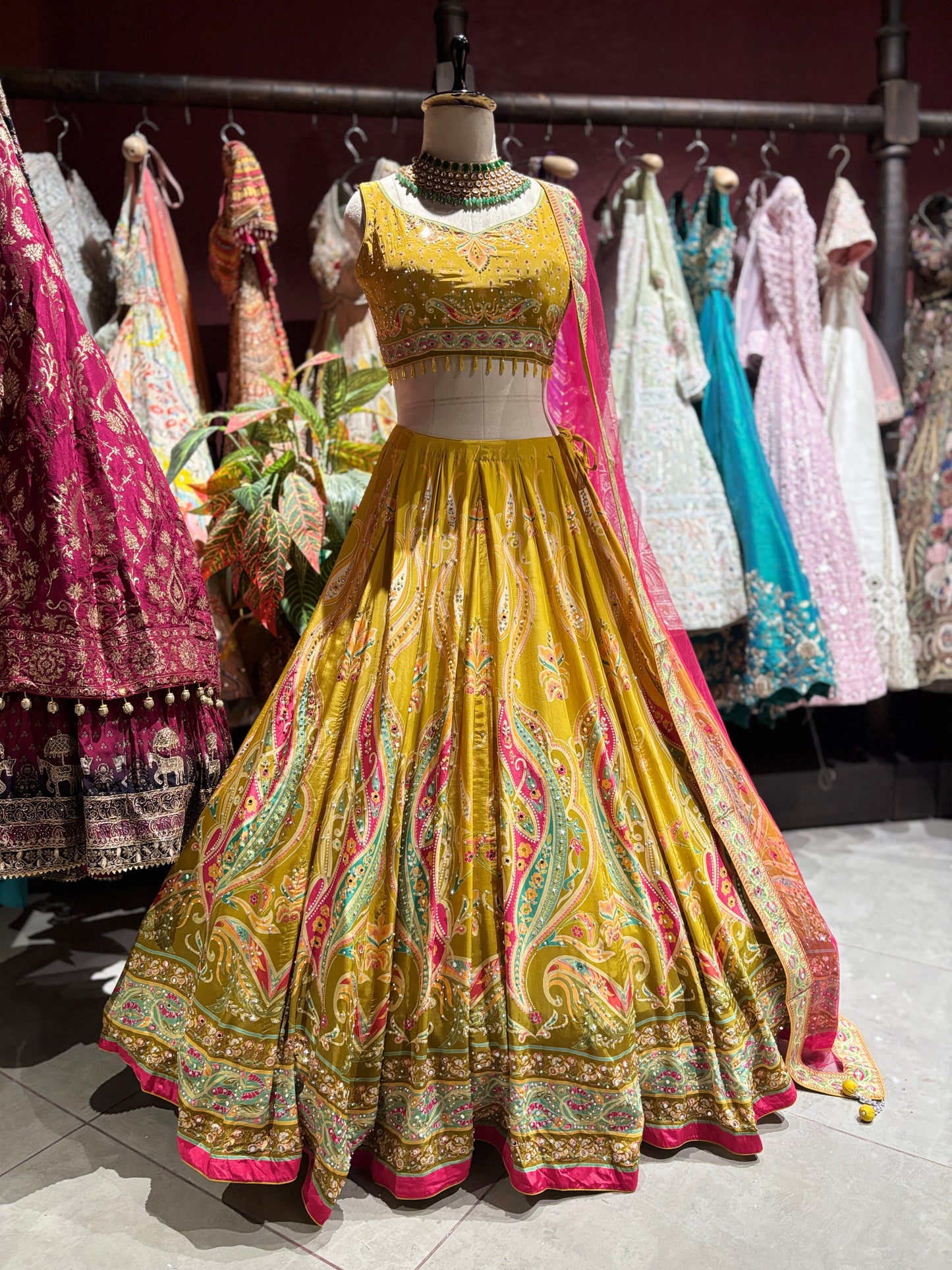 Mustard Yellow Paisley Embellished Lehenga Choli with Pink Dupatta