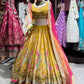 Mustard Yellow Paisley Embellished Lehenga Choli with Pink Dupatta