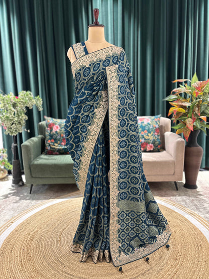 Teal Blue Printed Saree with Heavy Hand Embroidered Border