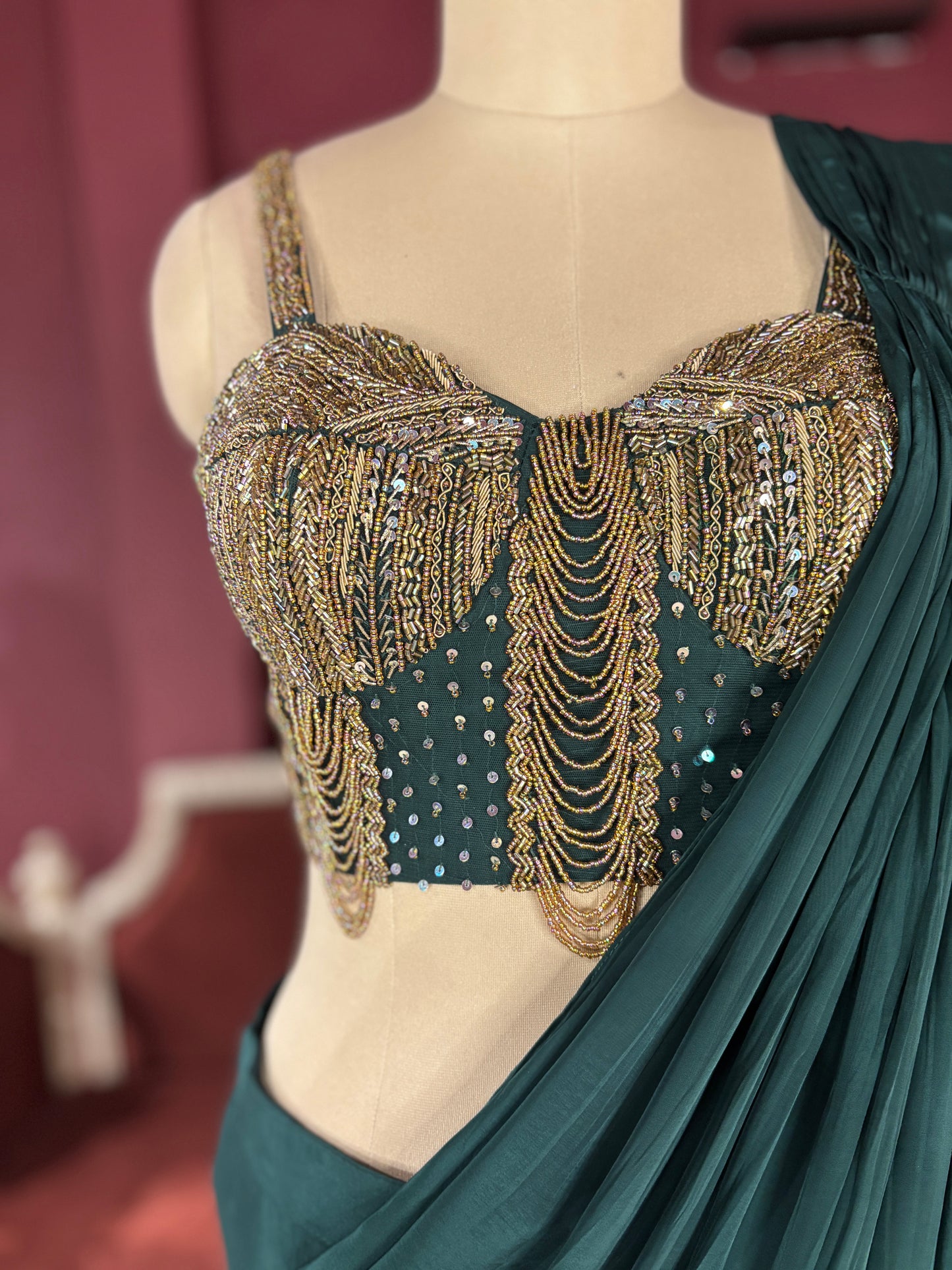 Designer Dark Green Drape Saree with Ornate Blouse